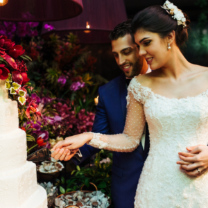 newlyweds cutting cake at wedding